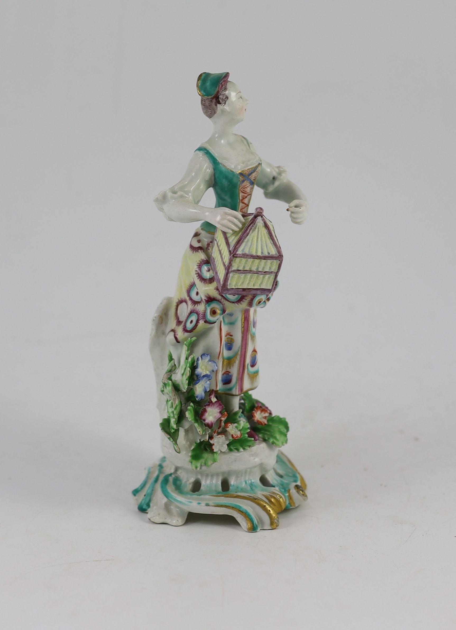 A Bow porcelain figure of a lady, emblematic of Matrimony, c.1765, 20.5cm high